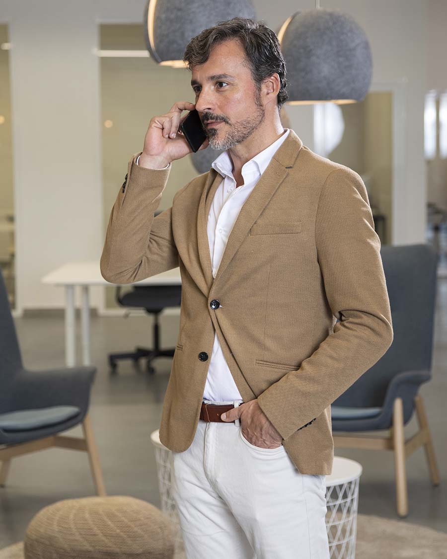 Confident single professional standing in a refined modern interior