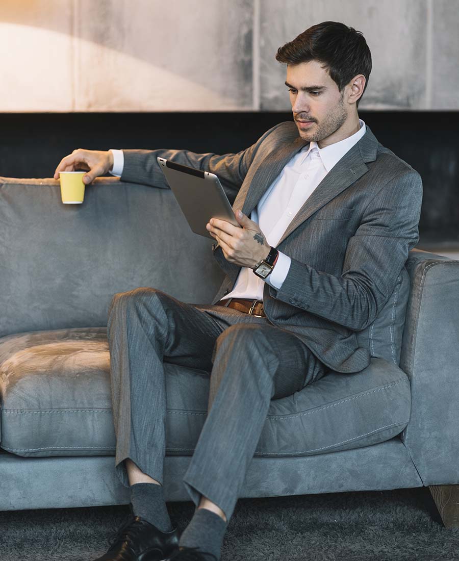 Well-dressed professional man in an elegant private lounge